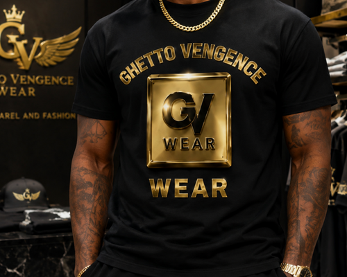 A man wearing a black t-shirt with a large metallic gold 'Ghetto Vengeance Wear' graphic on the front, standing in a retail store environment with other branded apparel visible in the background.