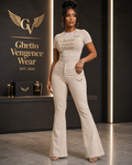 Elevated streetwear meets sophisticated style in the Ghetto Vengence Wear Signature Beige Flare Set. This coordinated women's look features a fitted short-sleeve top paired with high-waisted flare-leg pants for a sleek, flattering silhouette. Rich gold Ghetto Vengence Wear lettering across the chest and signature GV wing logo detailing give the set a polished luxury finish.

Fitted short-sleeve top with gold GV lettering
High-waisted flare-leg pants for a flattering silhouette
Signature GV wing logo detaili