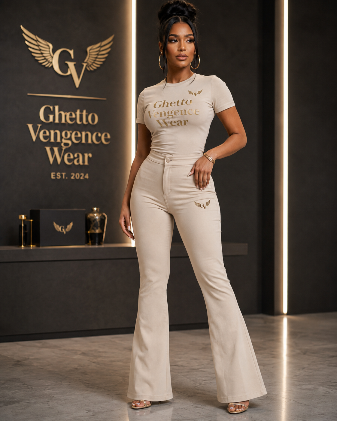 Elevated streetwear meets sophisticated style in the Ghetto Vengence Wear Signature Beige Flare Set. This coordinated women's look features a fitted short-sleeve top paired with high-waisted flare-leg pants for a sleek, flattering silhouette. Rich gold Ghetto Vengence Wear lettering across the chest and signature GV wing logo detailing give the set a polished luxury finish.

Fitted short-sleeve top with gold GV lettering
High-waisted flare-leg pants for a flattering silhouette
Signature GV wing logo detaili