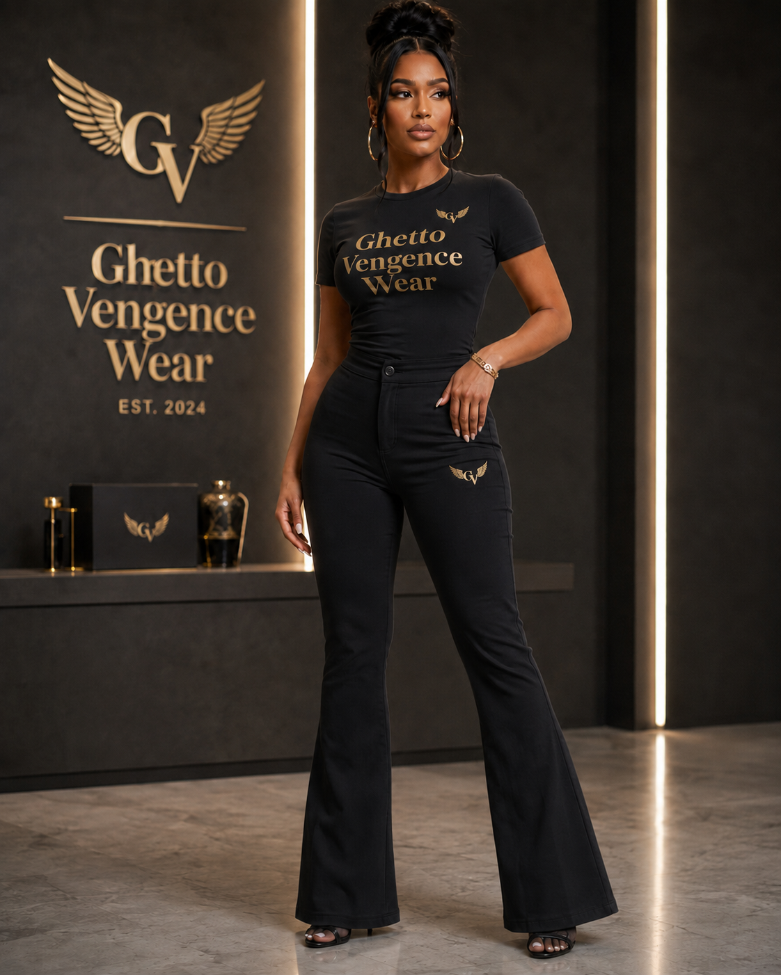 Elevated streetwear meets sophisticated style in the Ghetto Vengence Wear Signature Black Flare Set. This coordinated women's look features a fitted short-sleeve top paired with high-waisted flare-leg pants for a sleek, flattering silhouette. Rich gold Ghetto Vengence Wear lettering across the chest and signature GV wing logo detailing give the set a polished luxury finish.

Fitted short-sleeve top with gold GV lettering
High-waisted flare-leg pants for a flattering silhouette
Signature GV wing logo detail